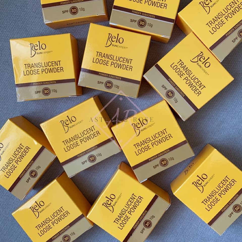 Multiple yellow boxes of translucent loose powder SPF 30 arranged on a flat surface.