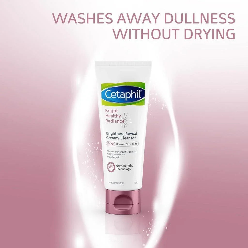 Cetaphil Brightness Reveal Creamy Cleanser tube for face, bright pink background, text washes away dullness without drying