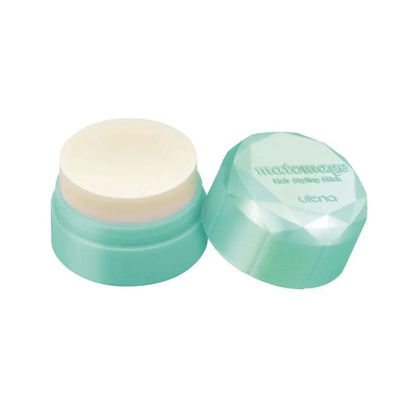 Green Matomage hair styling stick with open lid for strong hold