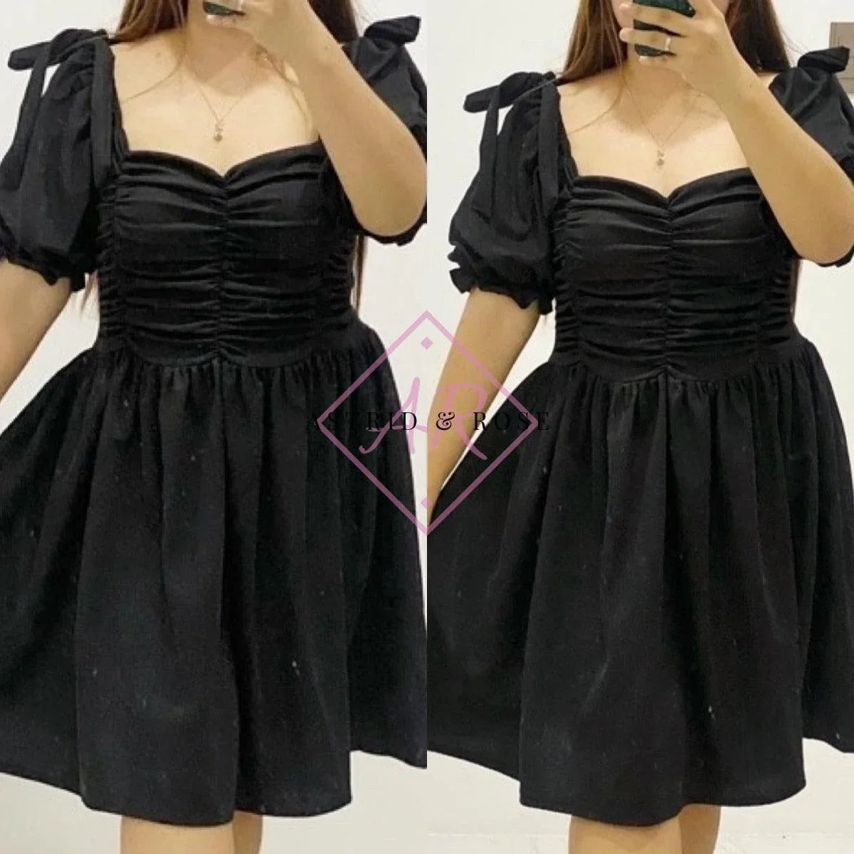 Plus size woman wearing short black dress with puff sleeves and ruched bodice, mirror selfie.