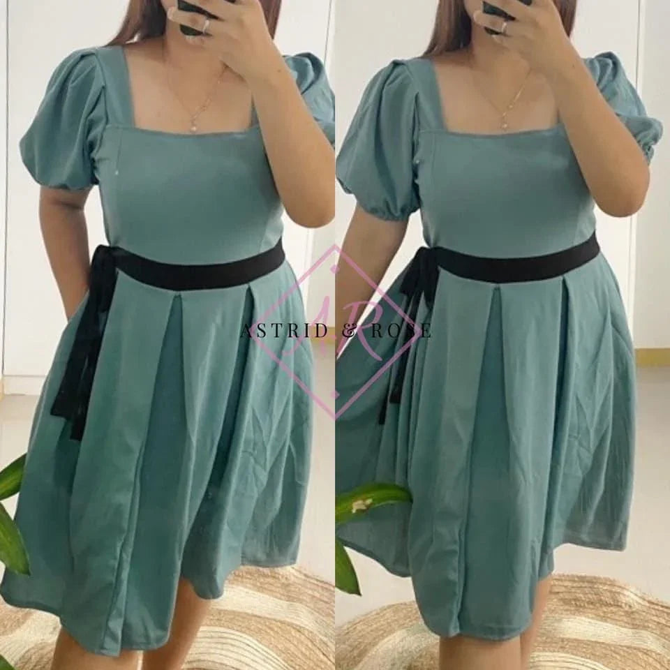 Plus size green dress with puff sleeves, square neckline, black waist tie, knee length