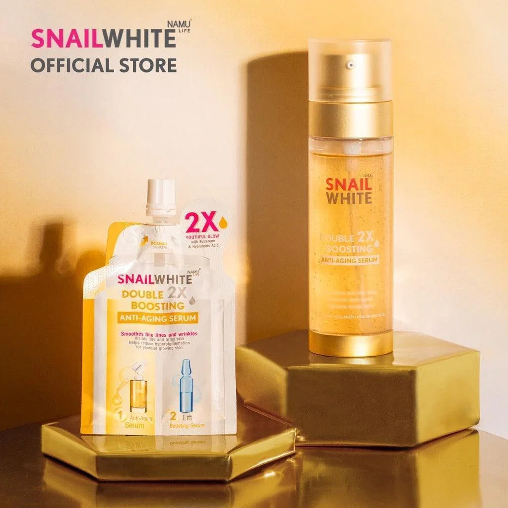 Snail White Double 2X Boosting anti-aging serum sachet and bottle on gold stands