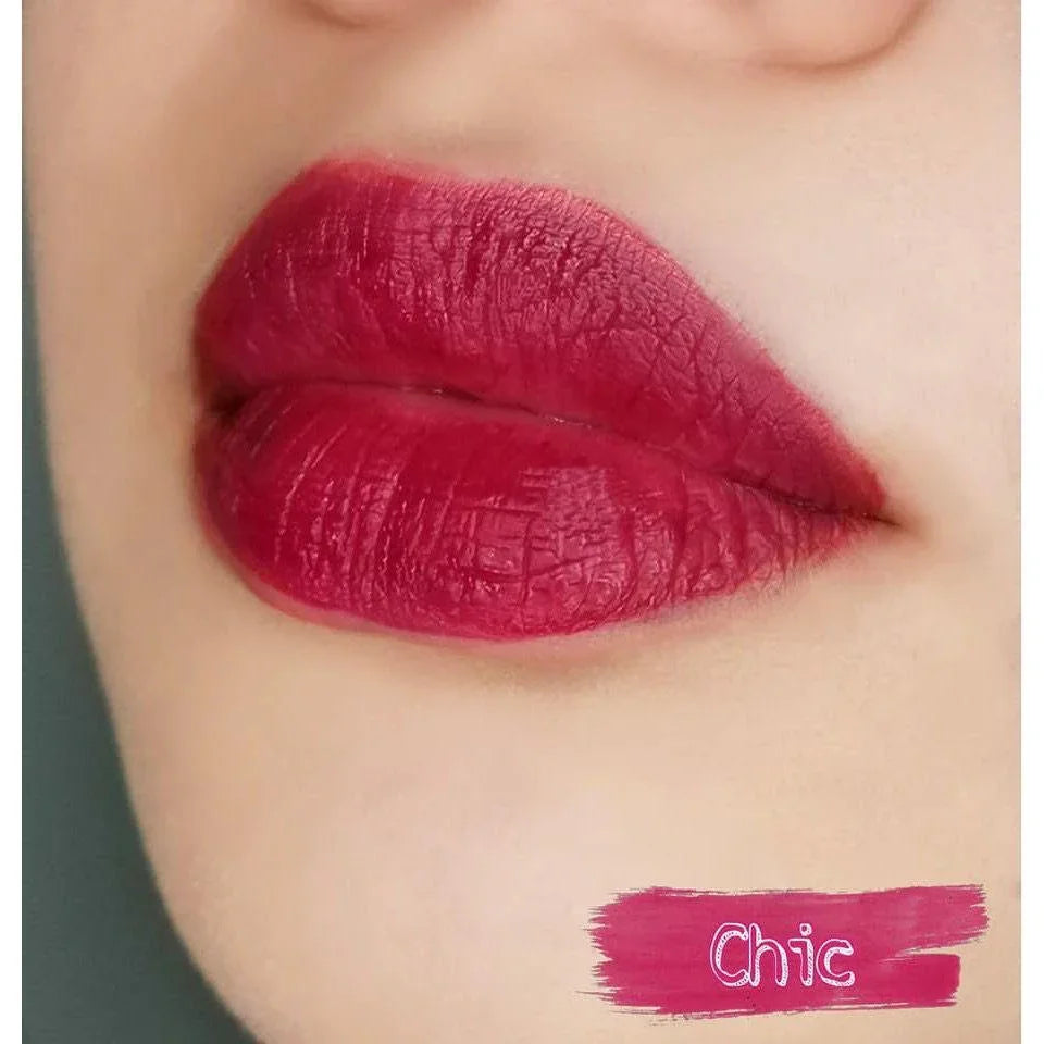 Close-up of lips wearing matte pink lipstick in Chic shade, bold lip makeup look
